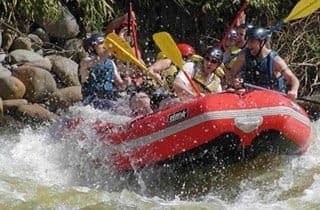 Class III–IV rapids on the Pacuare River — guided full-day rafting trip
